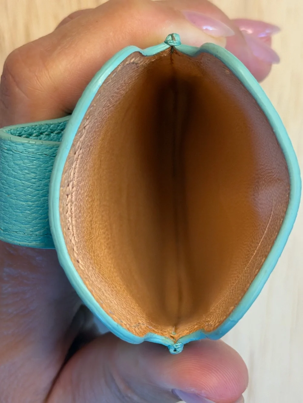 Tiffany & Co. turquoise pebbled leather phone sleeve with gold logo